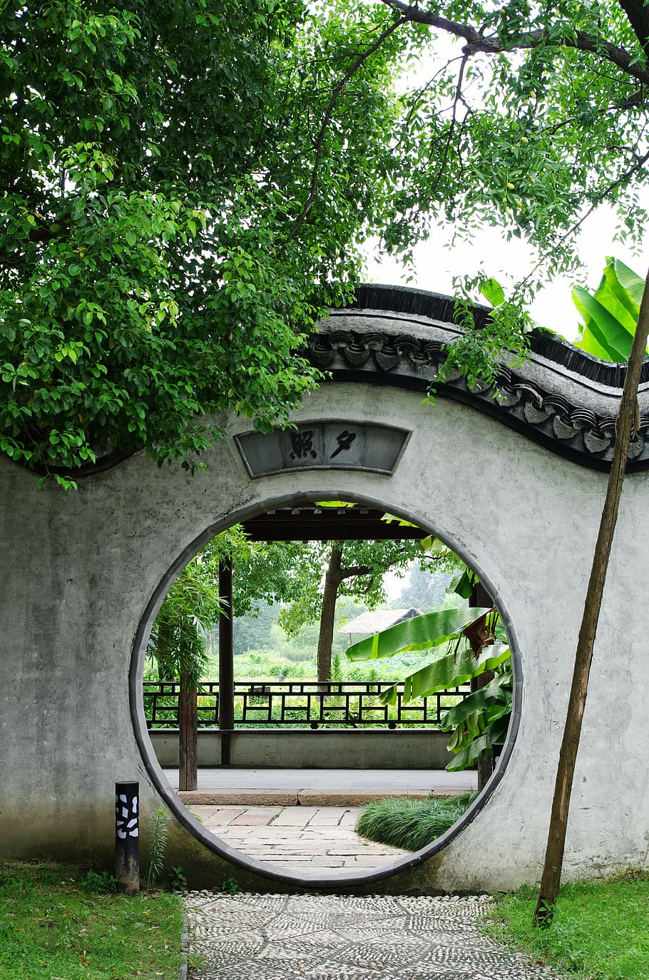 gray and black concrete hole arch, china wind, wuzhen, garden