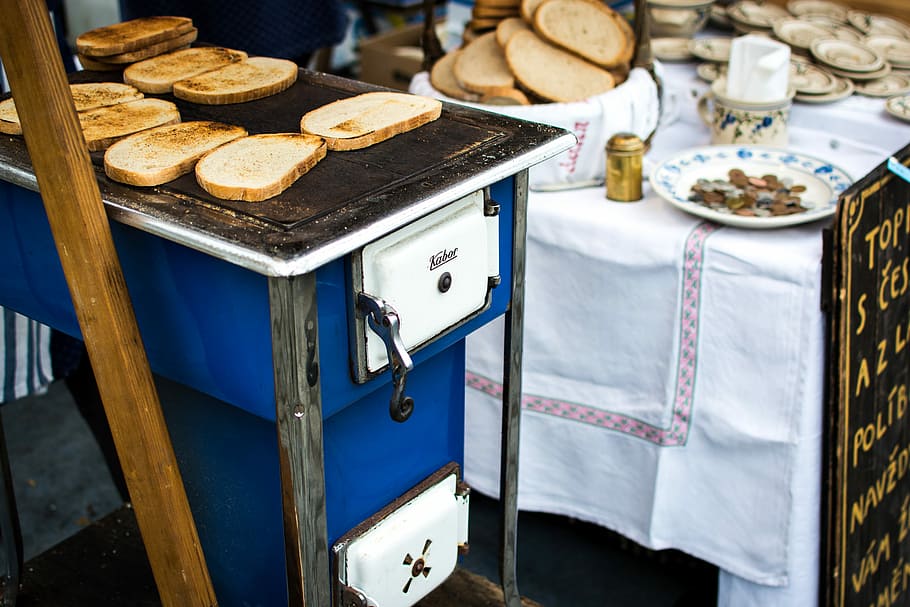 Traditional Czech toasted bread with garlic, hands, market, outside HD wallpaper