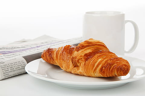 French bread on white ceramic plate beside white ceramic mug HD wallpaper
