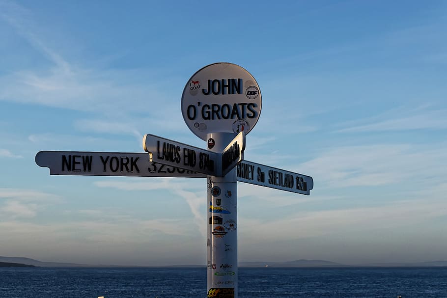 white signage, john o'groats, john o'groats signpost, attraction