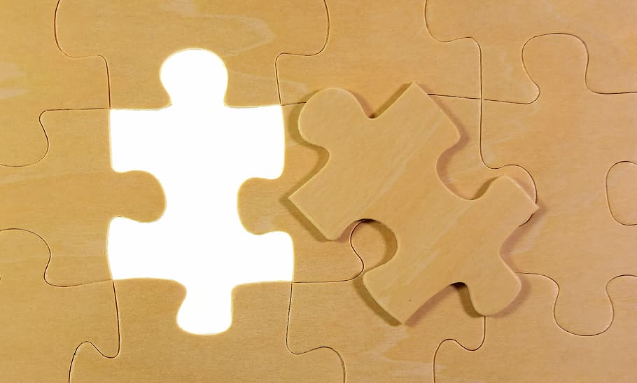 brown jigsaw puzzle piece, last part, joining together, insert