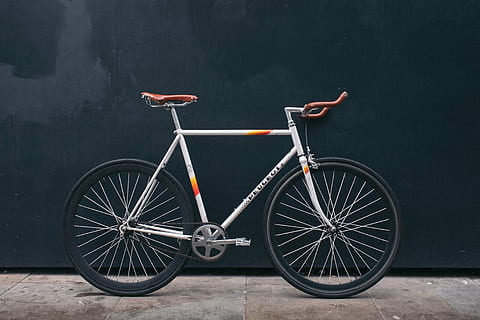 gray and orange road bike parked on black wall, bicycle, wheels HD wallpaper