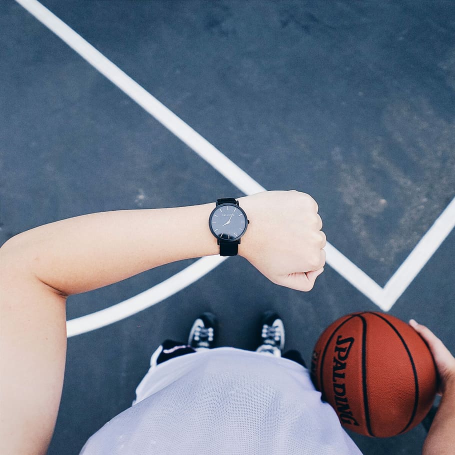 person wearing black analog watch and holding spalding basketball, HD wallpaper