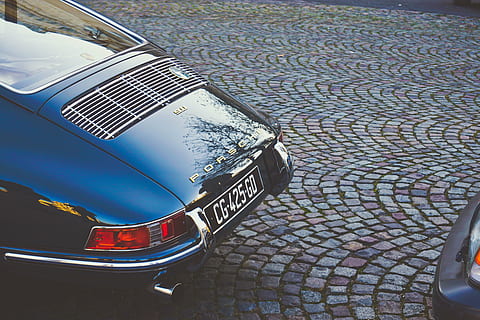 blue Porsche parked near vehicle, car, bricks, plate, number HD wallpaper
