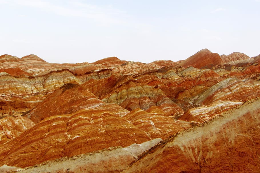 Danxia, brown rocks under blue sky photography during daytime HD wallpaper