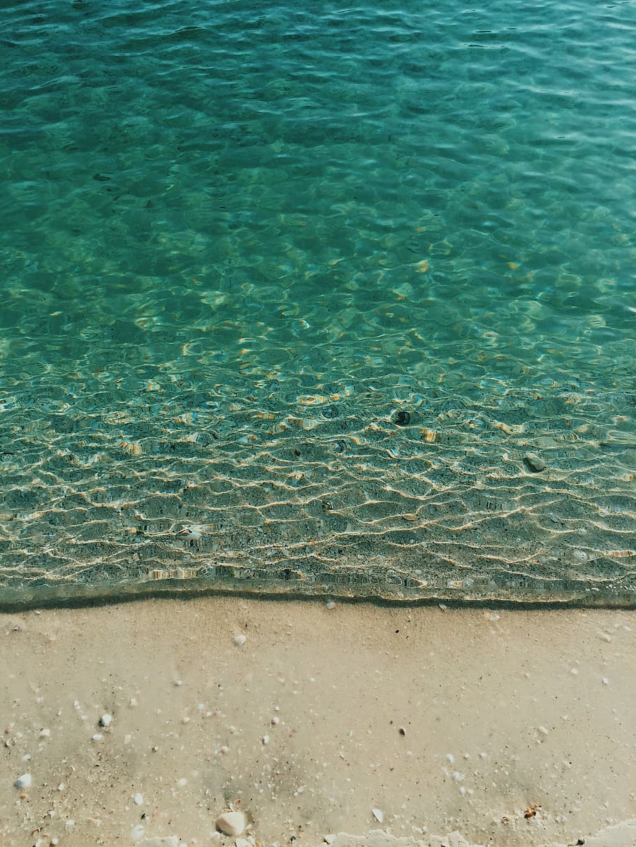calm body of water, time freeze photography of appearing border of water and sand at shore HD wallpaper