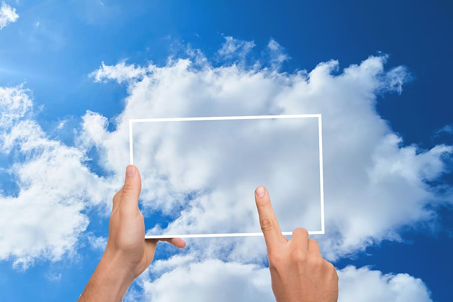 close-up photo of man touching screen, cloud, finger, tablet