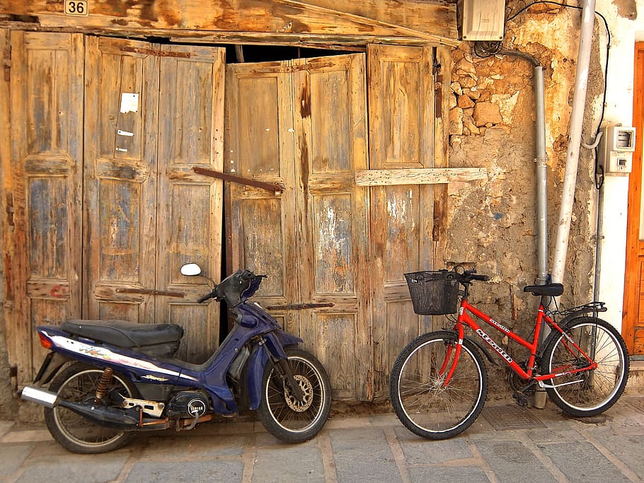 blue underbone motorcycle and red commuter bicycle leaning beside door HD wallpaper