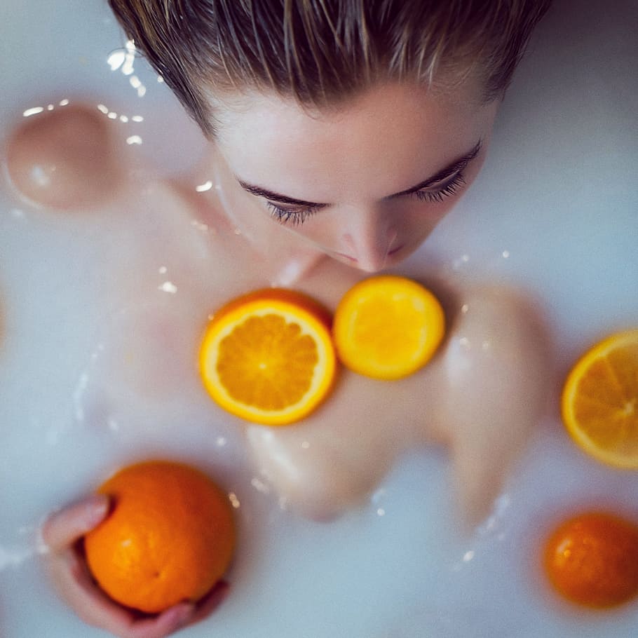 woman taking a bath, milk, orange, bath with milk, hairstyle