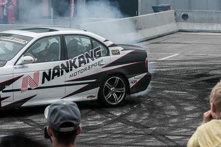white and black sports car drifting, racecar, smoke, bmw, transportation HD wallpaper