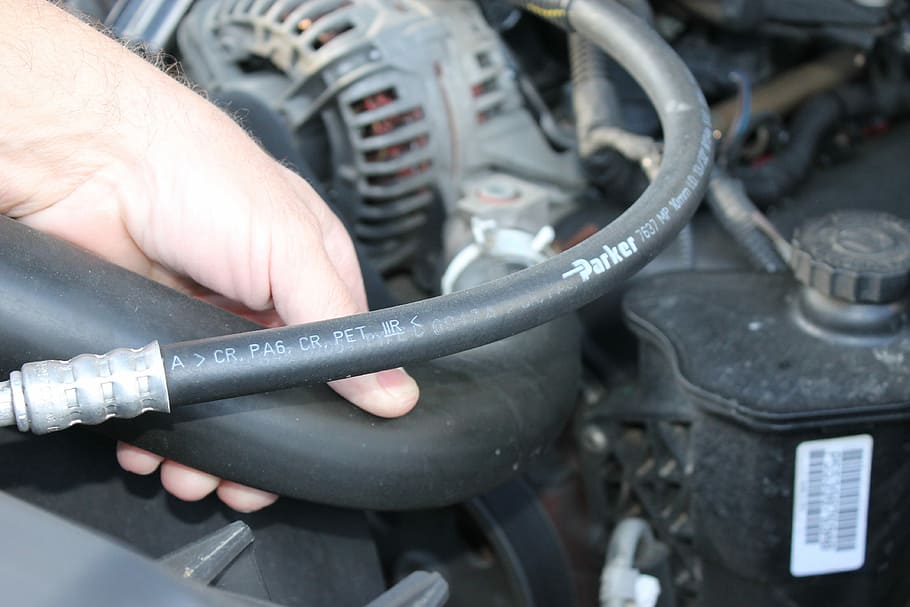 person holding black Parker vehicle engine hose, Automotive, Engine HD wallpaper