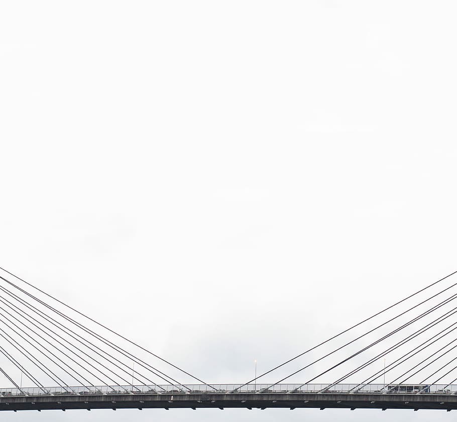 vehicles on grey suspension bridge under cloudy sky during daytime, assorted vehicle passing on gray metal suspension bridge during daytime HD wallpaper