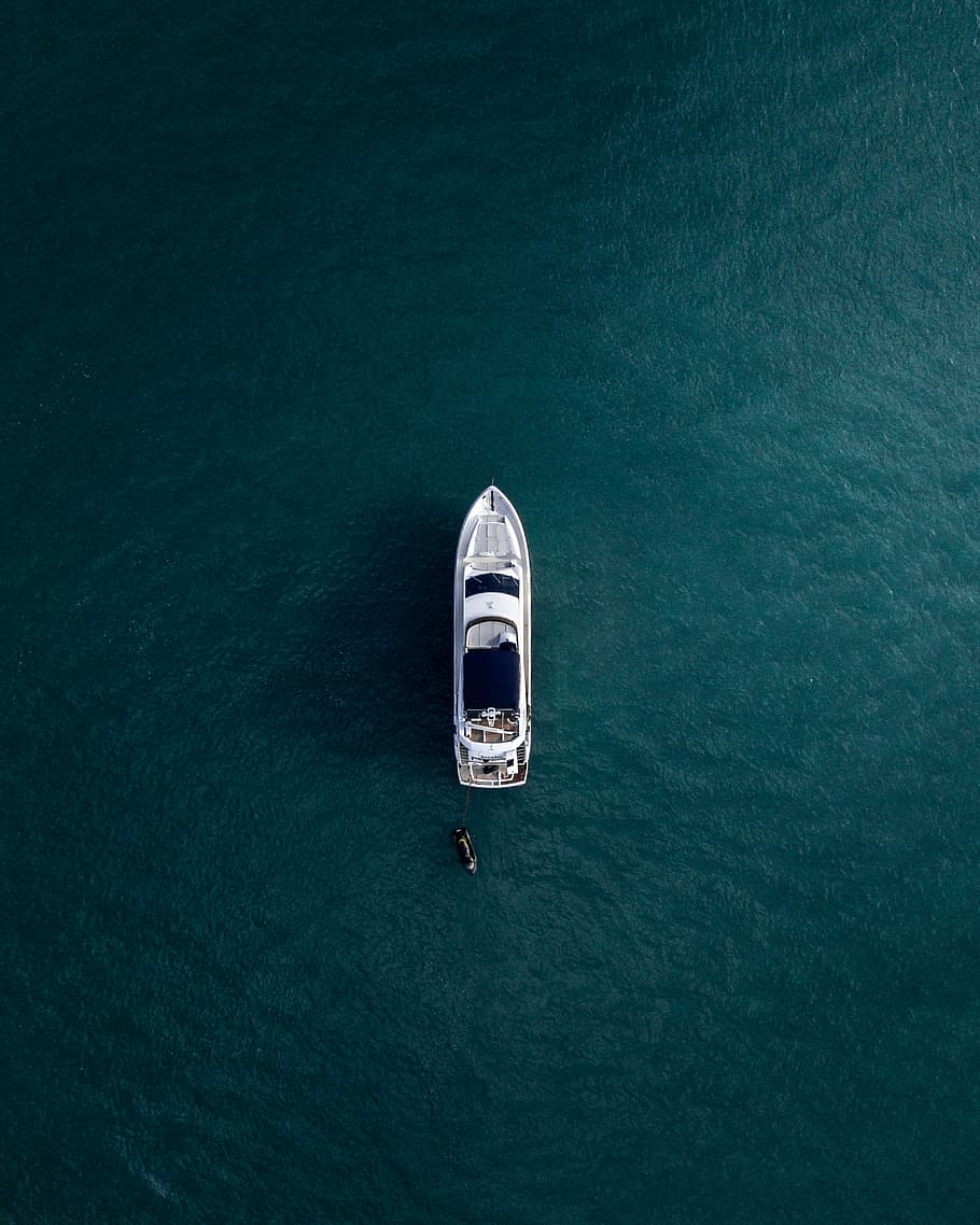 HD wallpaper: aerial photography of white yacht on calm waters, aerial view photography of white boat on body of water - Wallpaper Flare