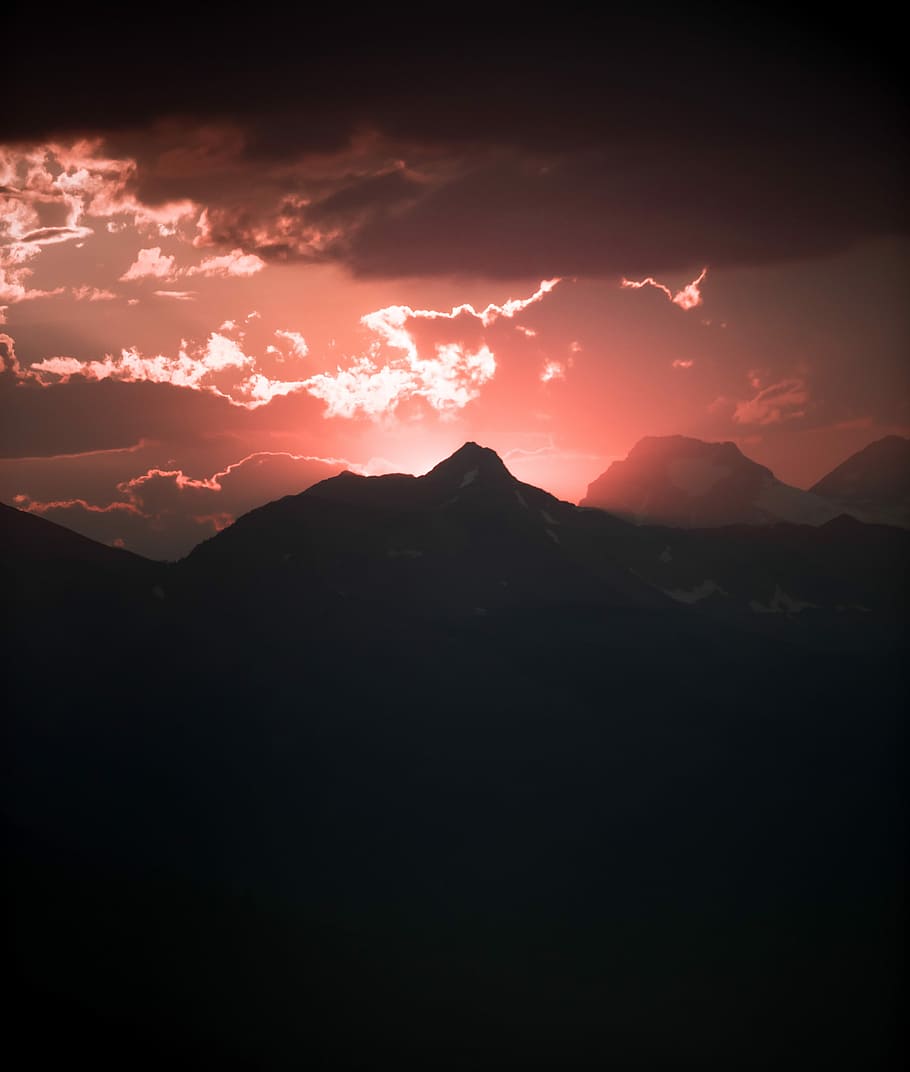silhouette of mountain under red sky panoramic photography, selective color photography of clouds HD wallpaper