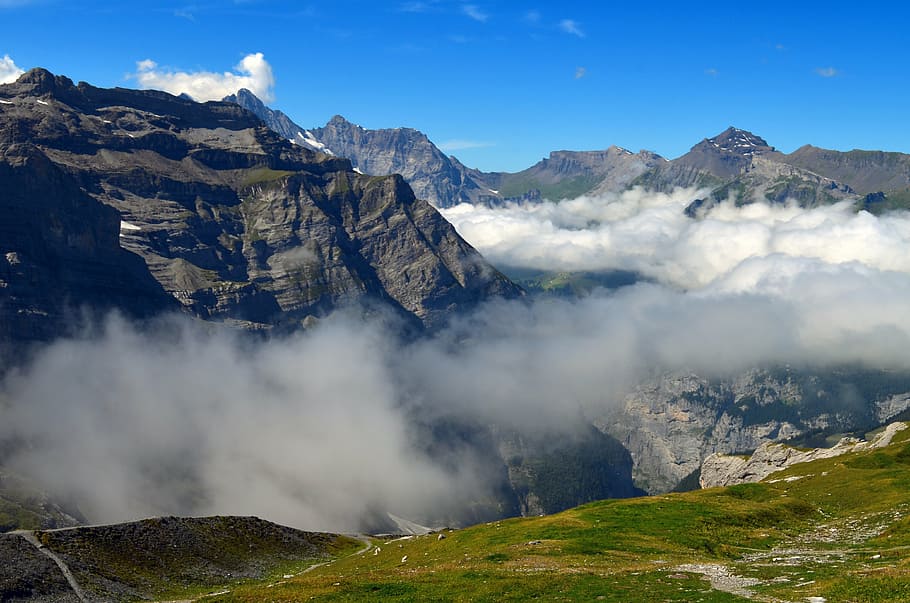 gray rocky mountain surrounded by clouds, mountains, landscape HD wallpaper