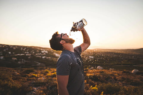 time lapse photography of man drinking water, dringkin, daytime HD wallpaper