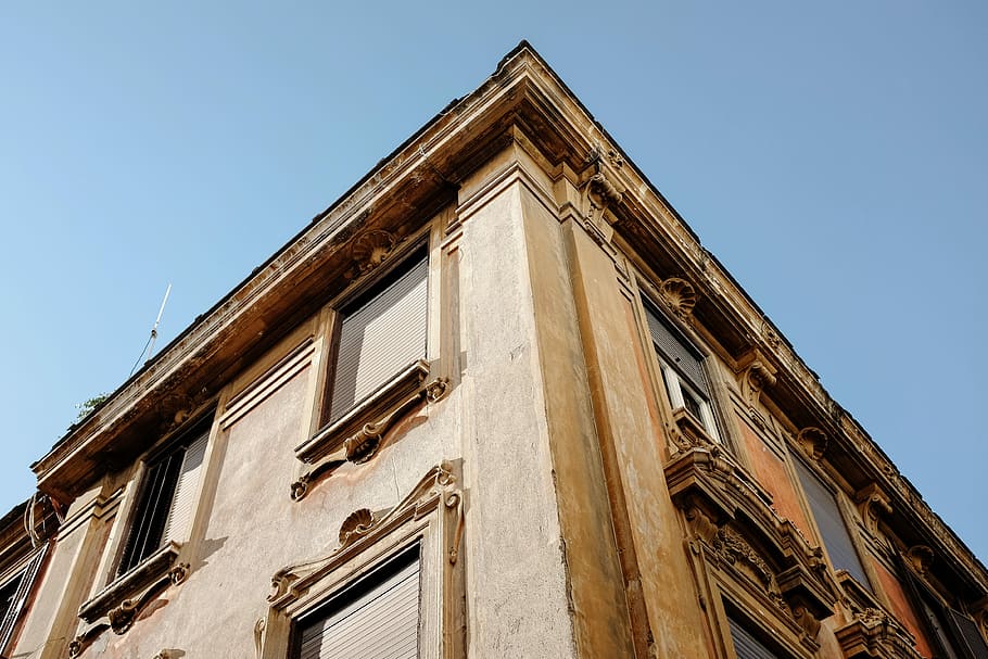 low angle view of brown building, worm's eye view of brown building during daytime HD wallpaper