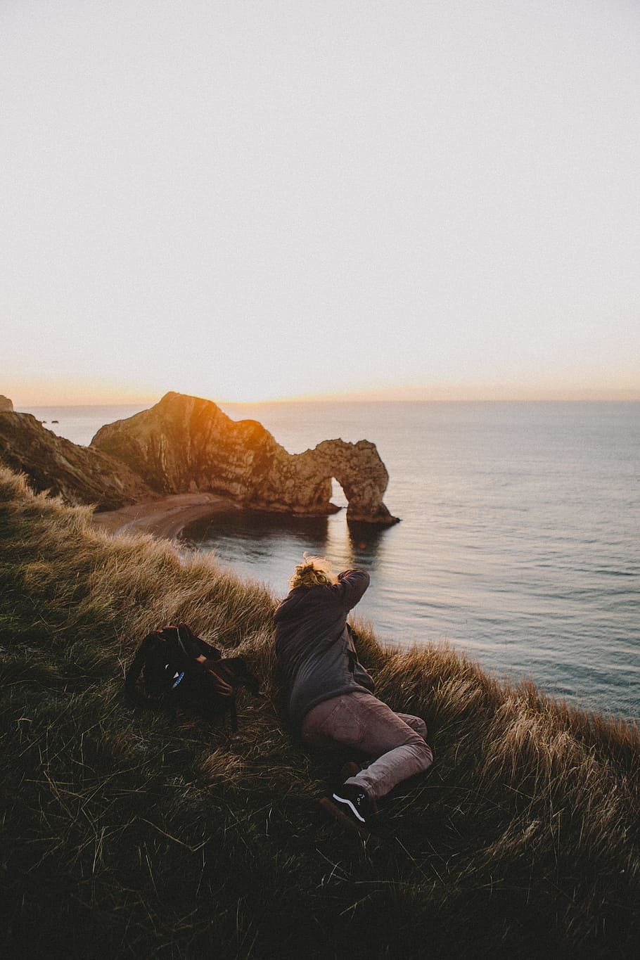 grass, blur, coast, sea, water, sunrise, cliff, rocks, view HD wallpaper