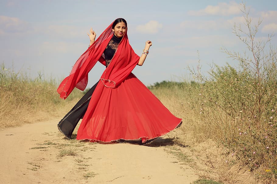 woman wearing red and black dress standing near grass, girl, indian, HD wallpaper
