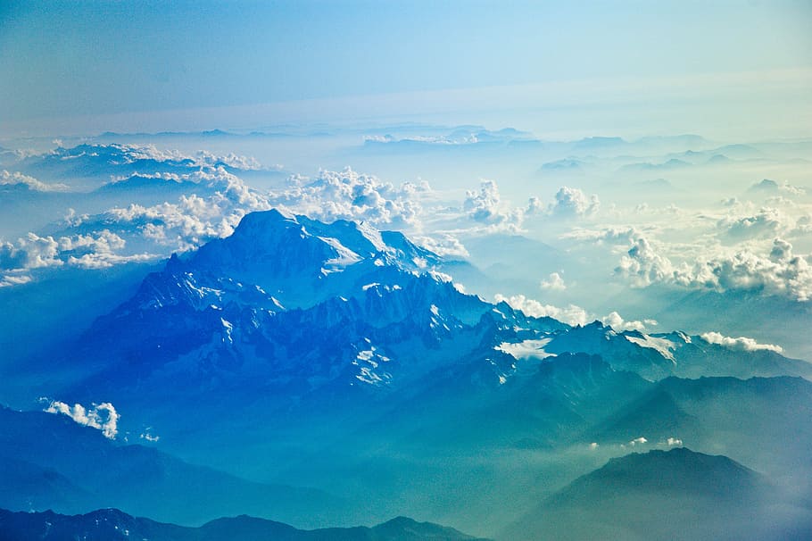 bird's-eye view of mountain rang, alp mountains under white clouds