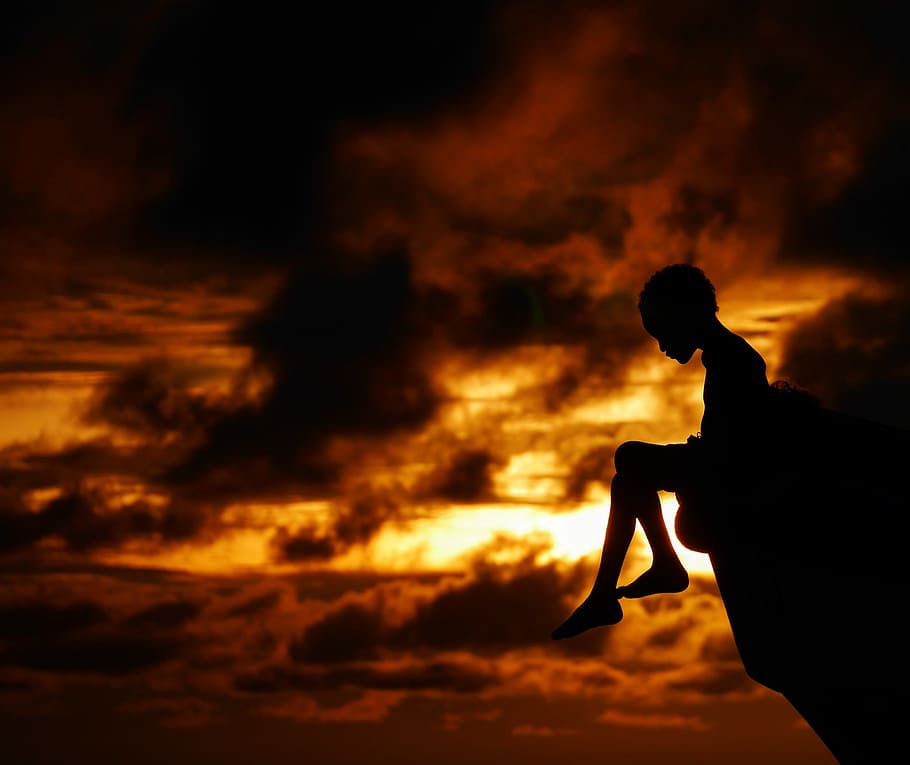 Rincon Del Mar, Colombia., silhouette photography of child sitting on rock during golden hour, HD wallpaper