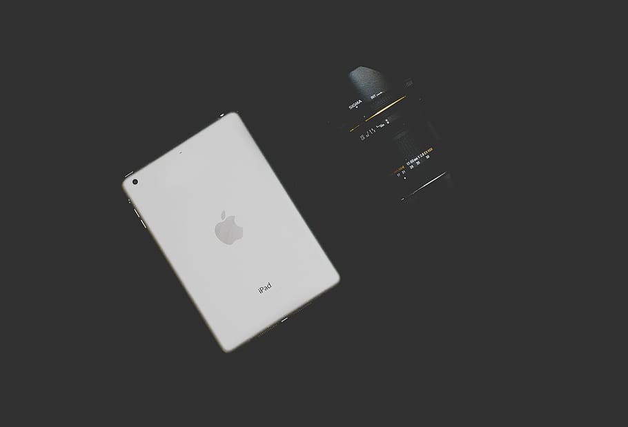 white iPad beside black camera lens, dslr, sigma, tablet, workstation