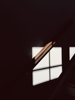 A dim shot of a wooden bannister illuminated by faint light from the window, untitled HD wallpaper