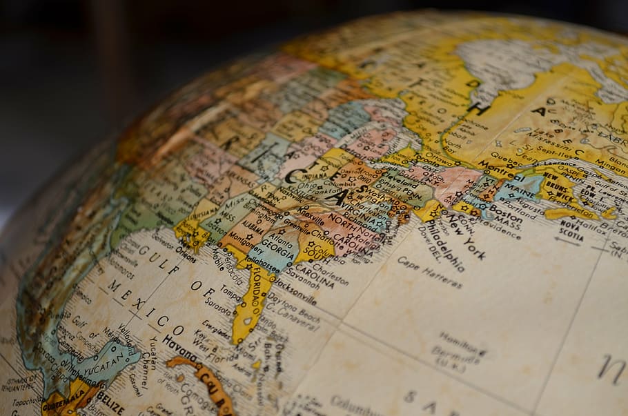 tilt shift lens photography of brown and white desk globe, map HD wallpaper
