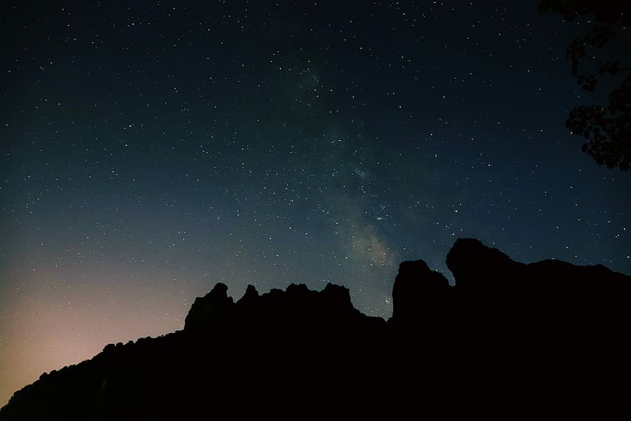 starry night, silhouette photography of mountain under starry nighjt HD wallpaper
