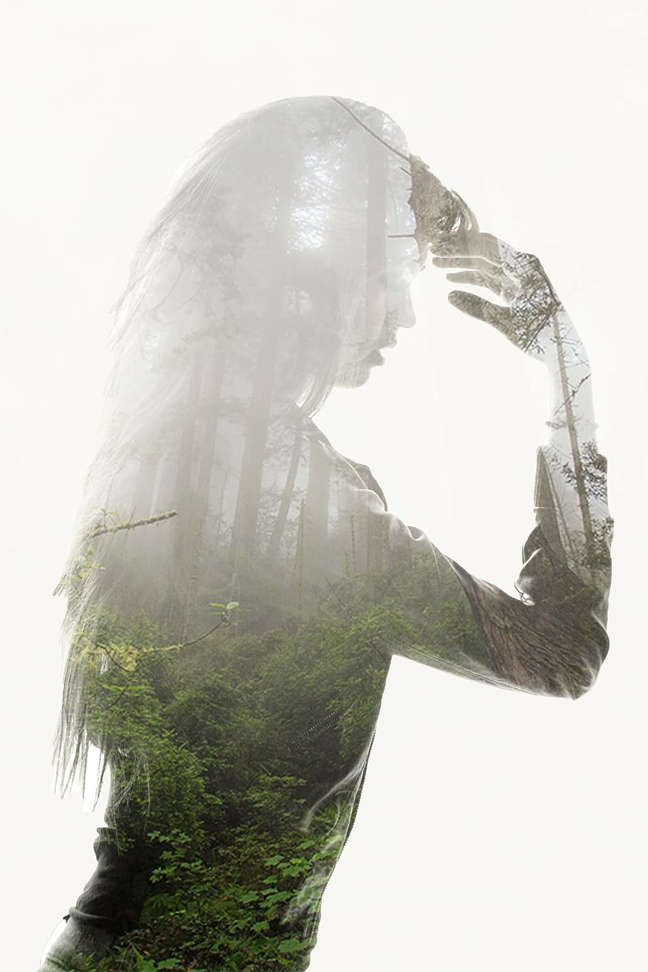 silhouette of woman with background of rain forest, double exposure