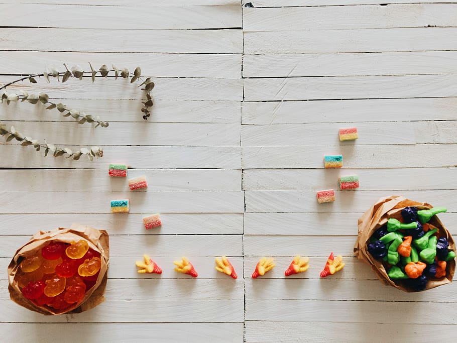 selective focus photography of candies on surface, assorted candy lot HD wallpaper