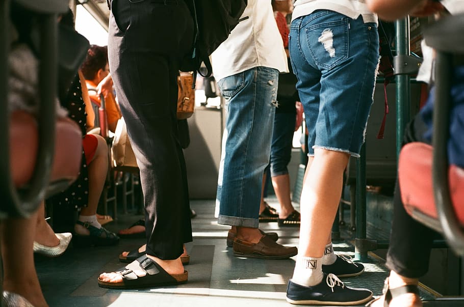 shallow focus photography of group of people riding on transport bus HD wallpaper