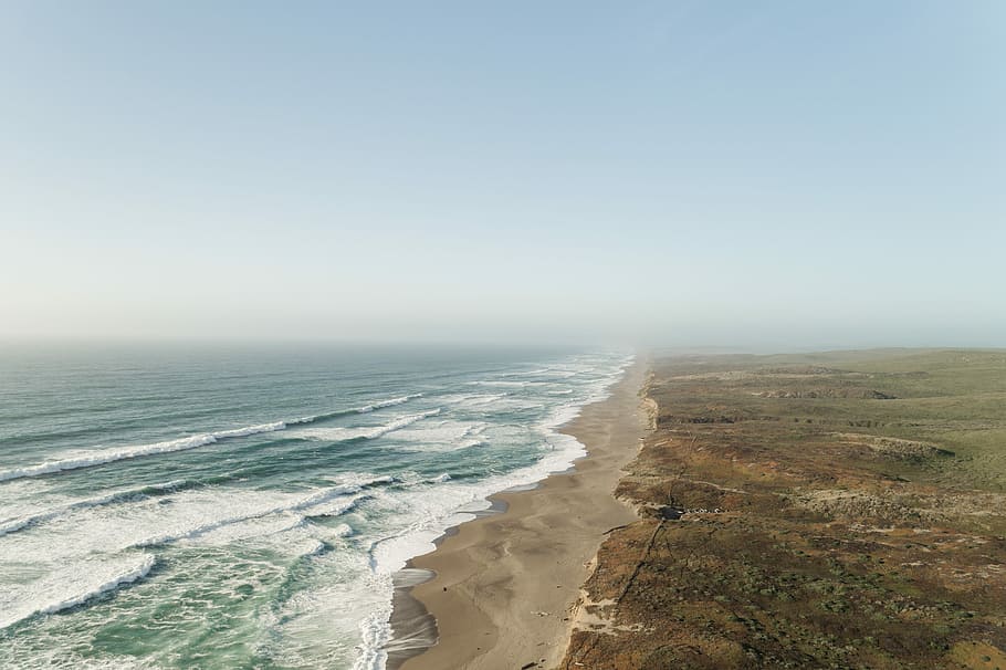 ocean near desert under white clouds during daytime, bird's eye photography of seashore body of water HD wallpaper