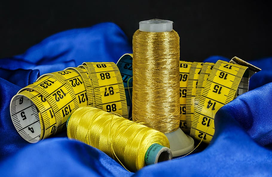 depth of field gold-colored and yellow threads beside tape measure, HD wallpaper