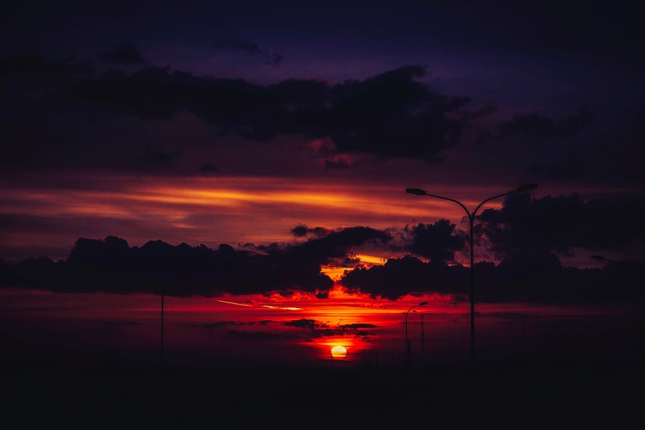 sunset, dusk, sky, clouds, sunlight, silhouettes, nature, outdoors HD wallpaper