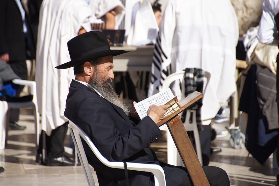 man sitting on chair and reading book, jerusalem, jewish, traditional