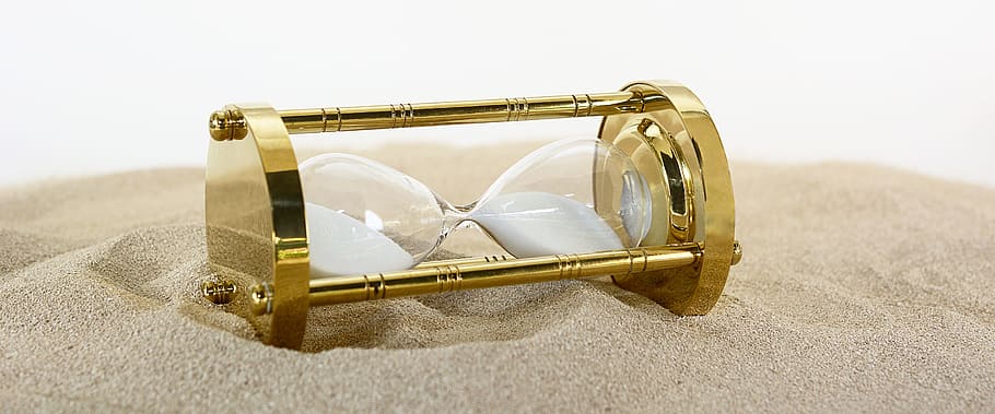 gold hour glass on beige sand, hourglass, clock, time, period, HD wallpaper