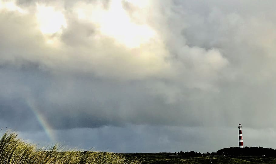 White and Red Lighthouse on Far Right and Rainbow on Far Left HD wallpaper