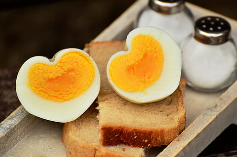 sliced boiled egg on bread loft, hen's egg, breakfast egg, heart HD wallpaper