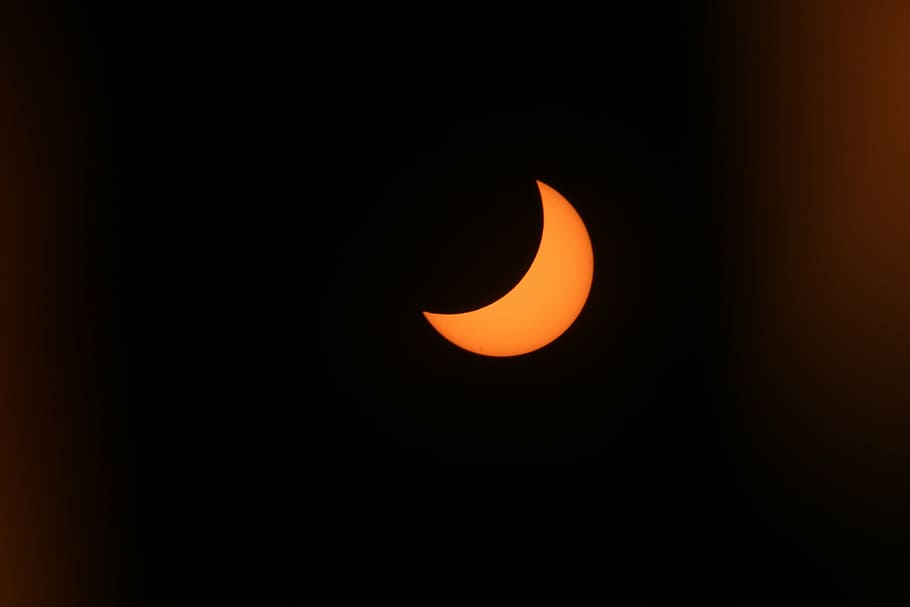 photo of crescent moon, solar eclipse, sun, blackout, celestial phenomenon