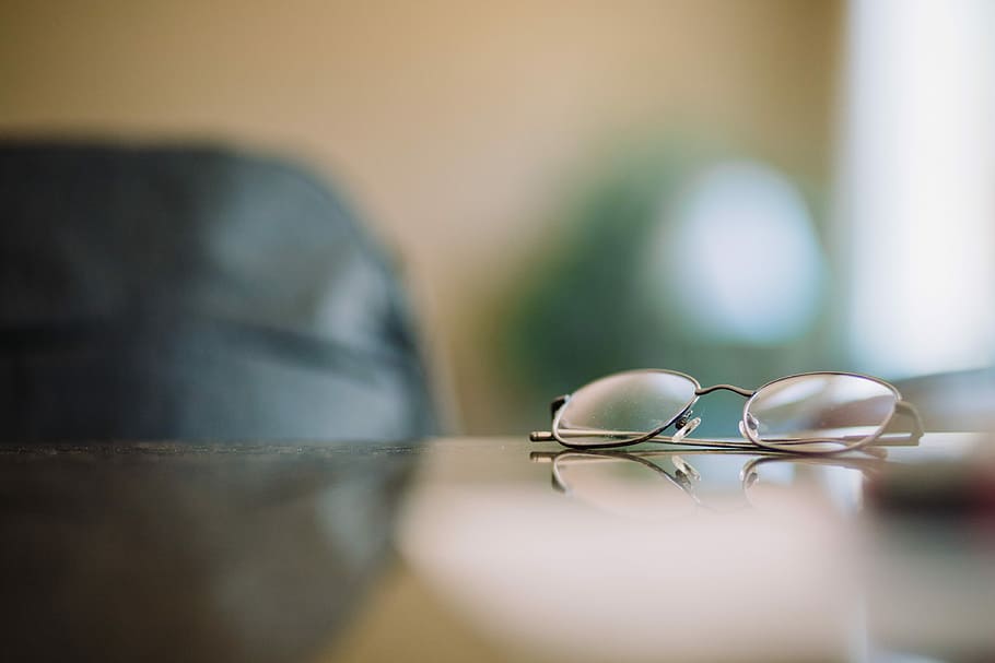 gray framed eyeglasses on table, eyeglasses with silver frames HD wallpaper