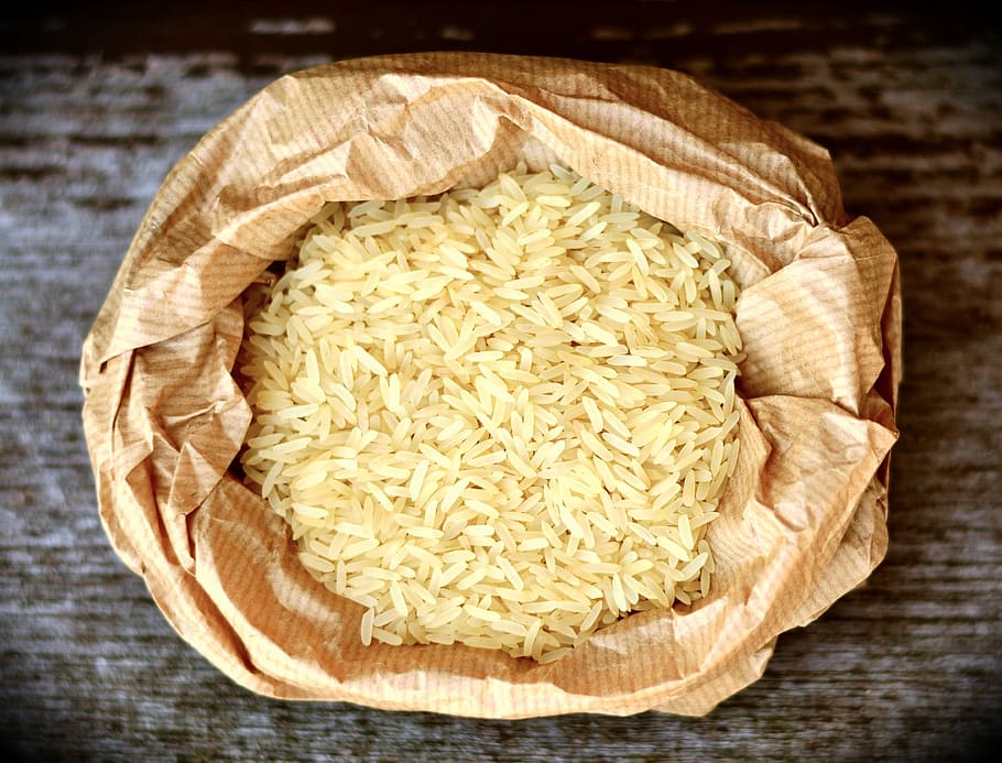 flat-lay photography of rice in paper pack, rice grains, food