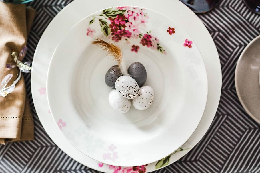 Round dinner table decorated with easter motifs, grey, holidays
