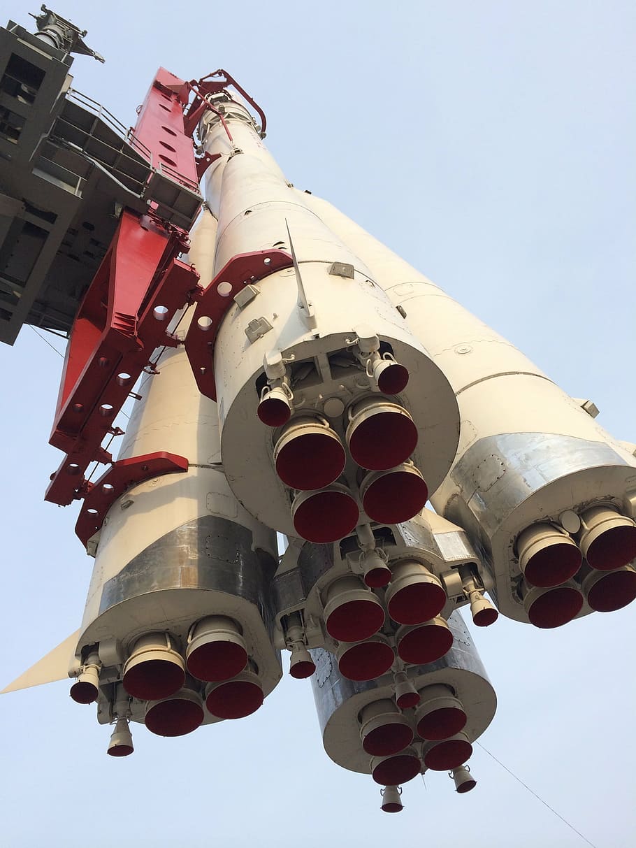 low angle photo of white and red rocket, cosmos, gagarin, cosmodrome