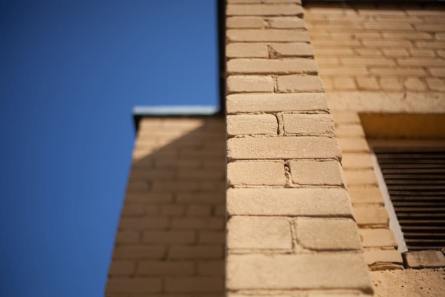 tilt photography of wall bricks, brown brick wall, yellow, architecture HD wallpaper