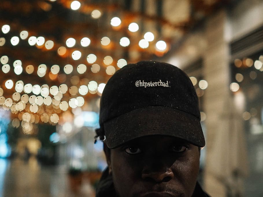 man taking selfie, man wearing black fitted cap, hat, lights HD wallpaper