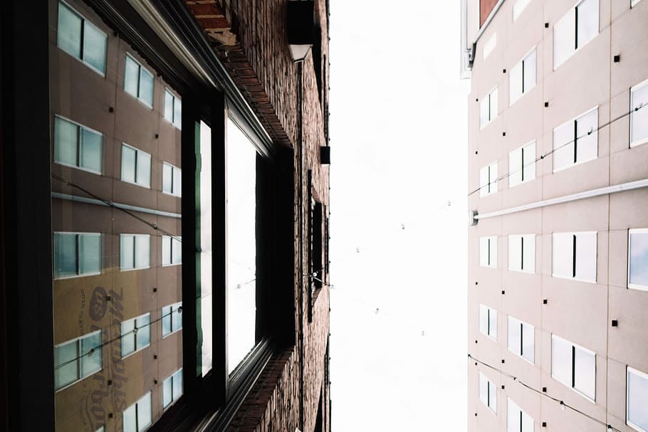 low angle photography of two high-rise buildings, bottom view of two brown concrete buildings HD wallpaper