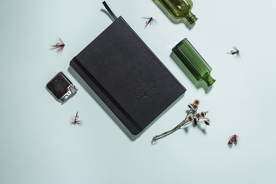 black hardbound book beside bottle, untitled, notebook, paper HD wallpaper