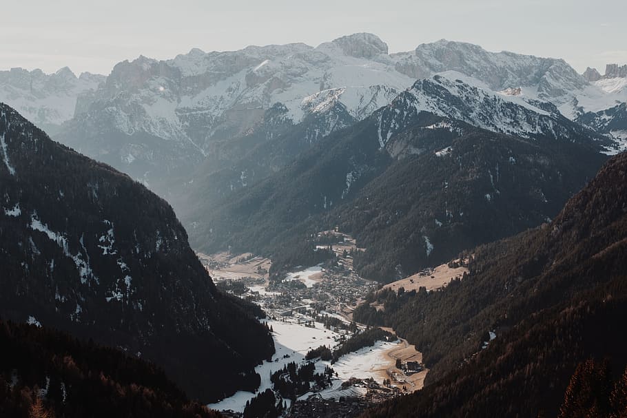 aerial photography of mountain partially covered with snow during daytime, aerial photograph of mountain ranges HD wallpaper