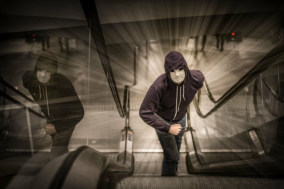 man in white mask and hooded jacket standing on escalator, run HD wallpaper